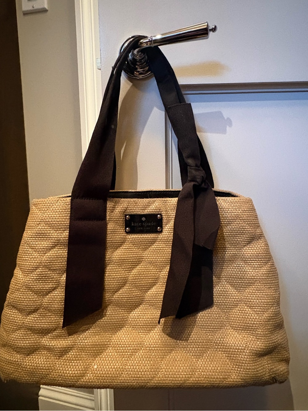 Black and tan Kate Spade Pursue